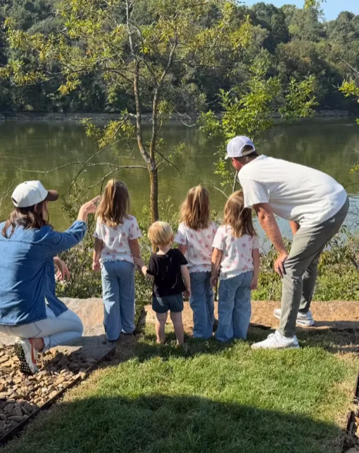 A family at the Beaver Lake shoreline