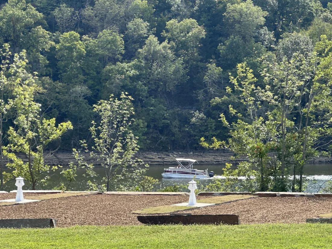 A pontoon idling past the bluffs