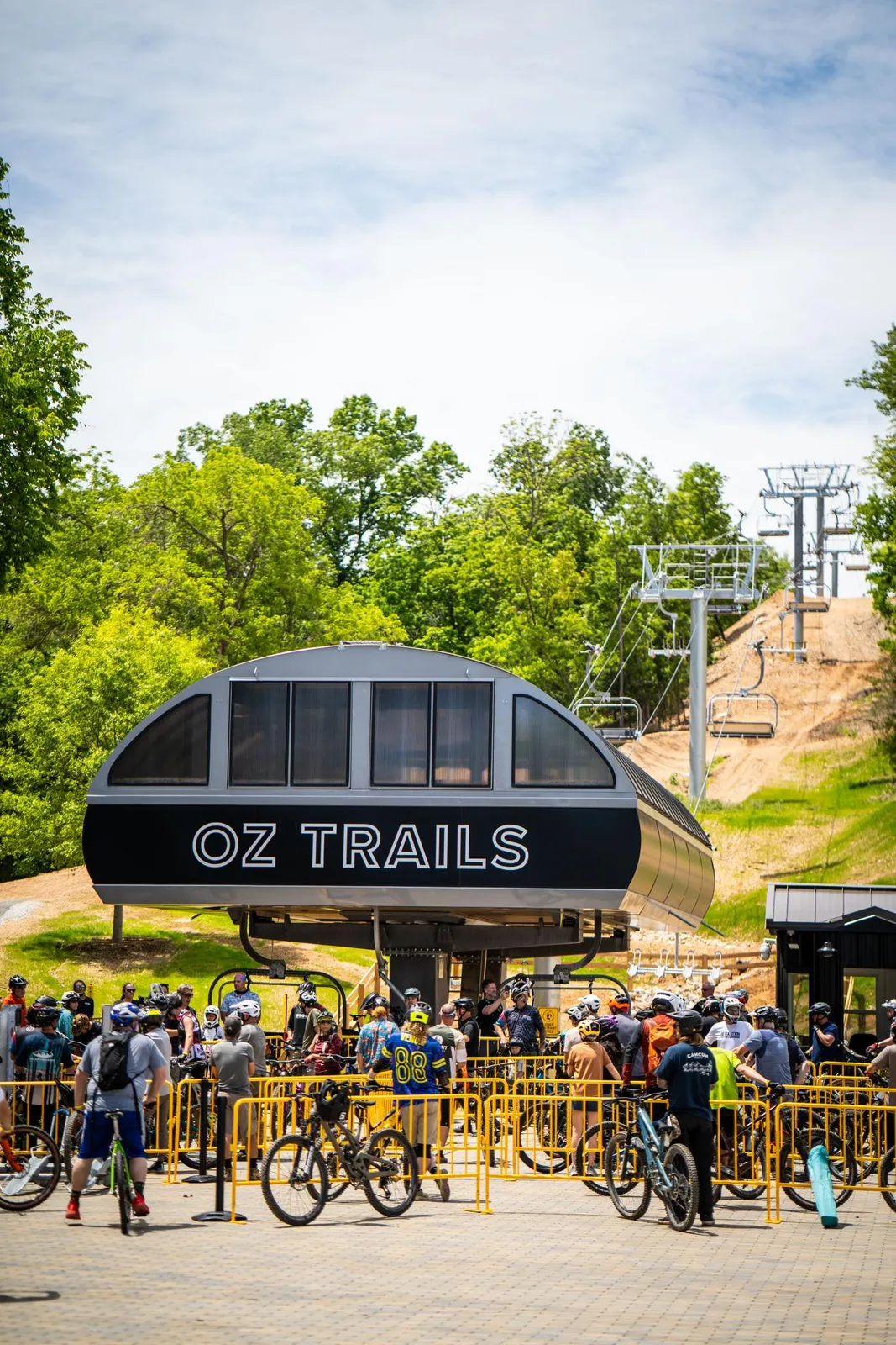 Riders waiting with mountain bikes at the OZ Trails lift